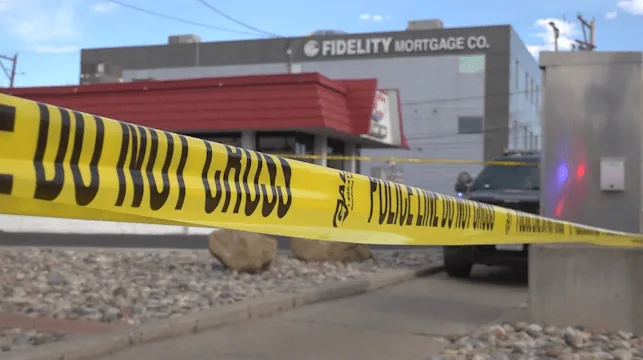 Grand Junction police vehicle parked near a Dairy Queen after a fatal officer-involved shooting