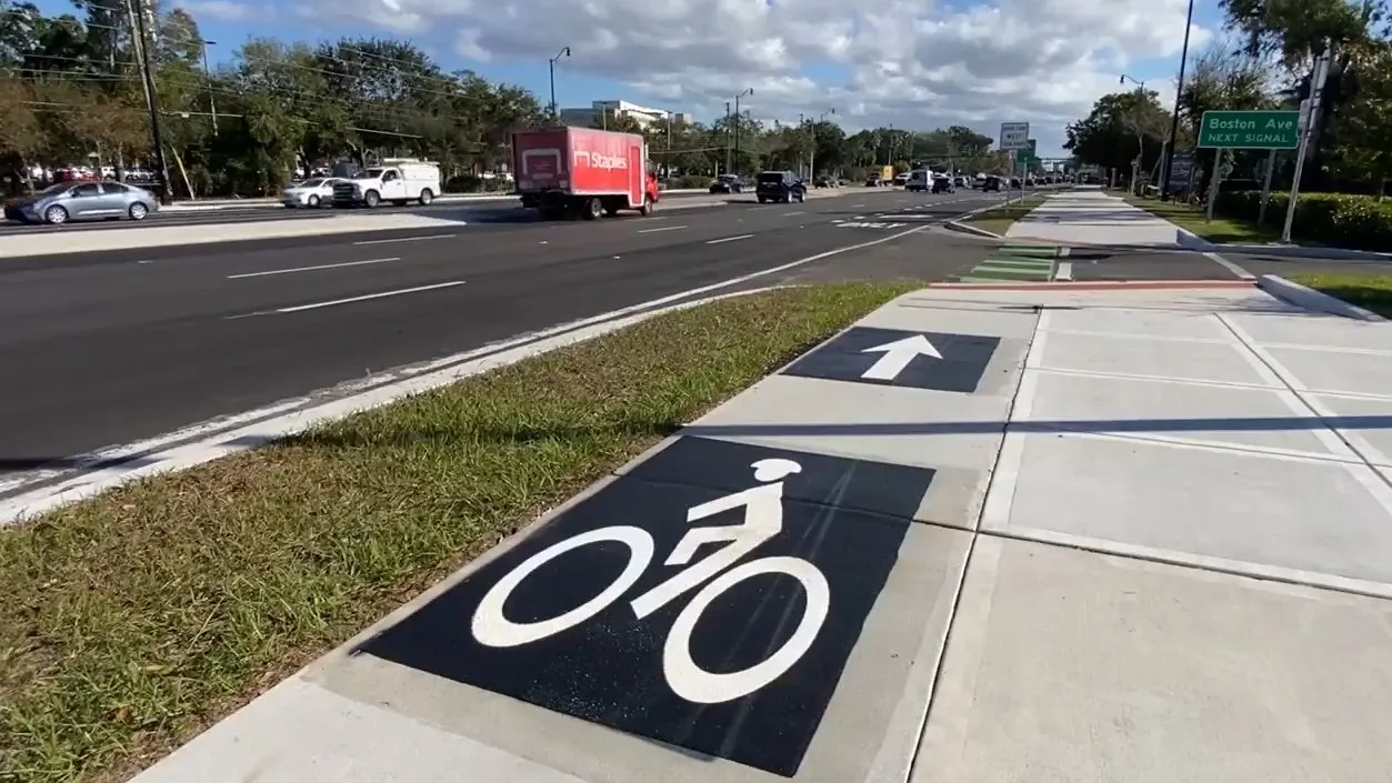A cyclist rides on a Florida street as advocates call for safer roads and better driver awareness